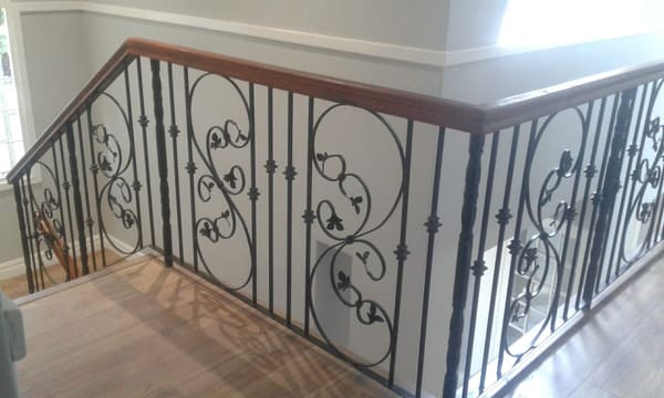 A wrought-iron hand railing on a staircase, made and installed